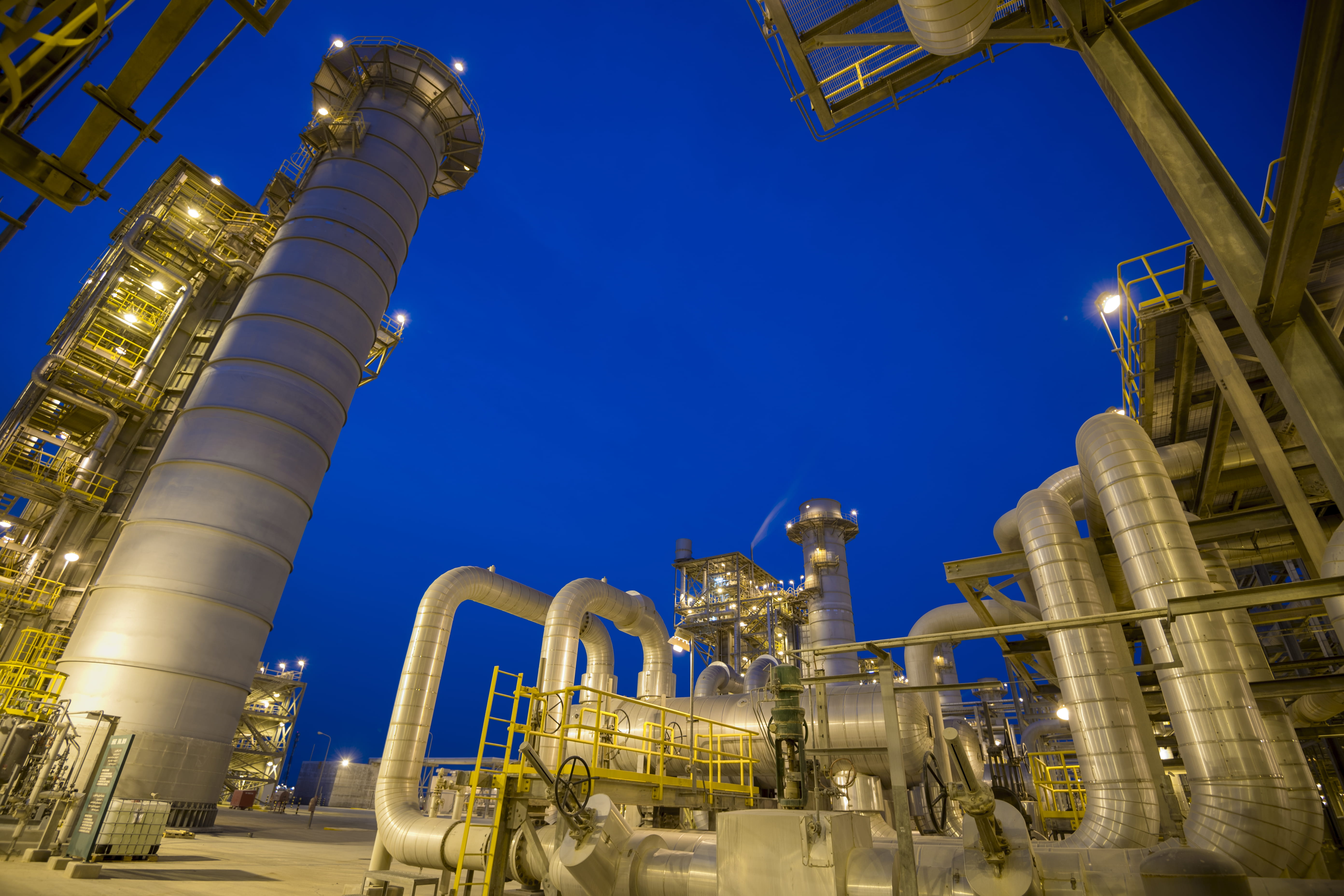 Night view of pipework at Saudi Aramco Wasit gas plant